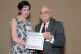 Dr. Nagib Callaos, General Chair, giving Dr. Caroline Sheedy the best paper award certificate of the session "Knowledge Management and Risk Management." The title of the awarded paper is "The Impact of Signature Pedagogy for Women in Information Sciences."